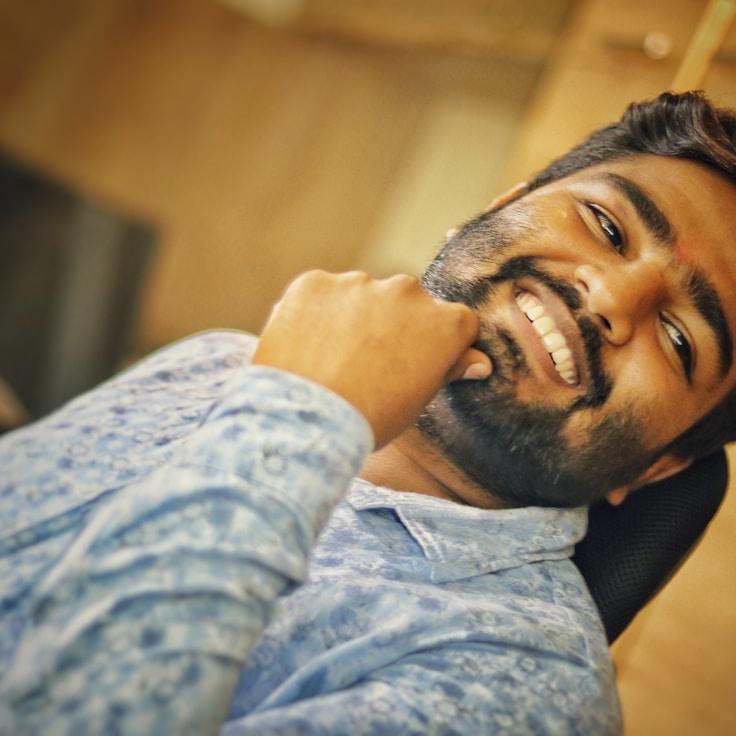 Anya Sharma, Lead Design Curator at MistMosaicStudio, reviewing corporate floral arrangements